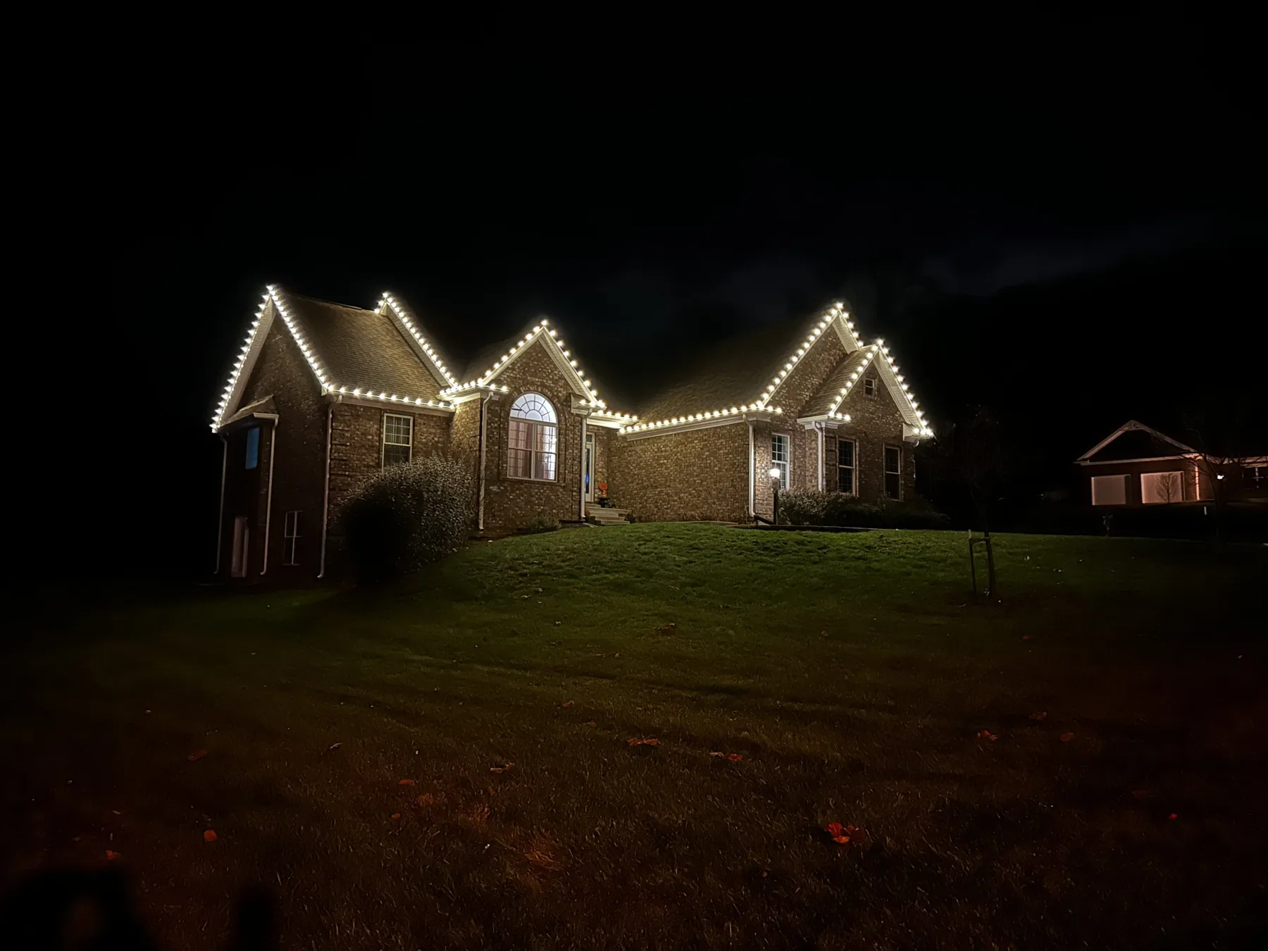 Warm white roofline across three gables, November 2023
